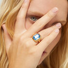 Rectangular ring with blue faceted crystal