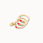 Triple ring with red crystals