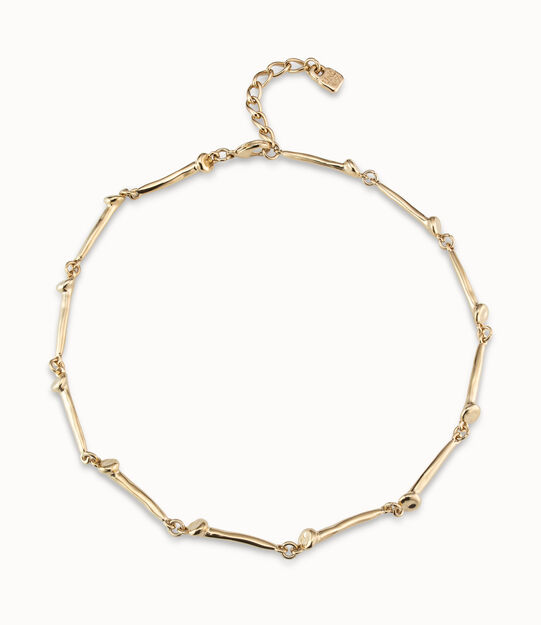 Collar bañado en oro de 18k con piezas en forma de clavo.