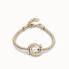 Pulsera el&aacute;stica de una vuelta ba&ntilde;ada en oro de 18k y abalorio doble luna y perla