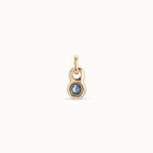 Round shaped Charm with a blue crystal