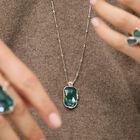 Multi-position necklace with a rectangular green faceted crystal