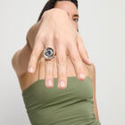 Eye-shaped ring with faceted blue crystal