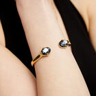Bangle bracelet with two faceted black oval crystals