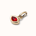 Charm with red crystal
