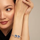 Bangle bracelet with two blue crystals