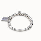 Beaded stretch bracelet with tubular piece and a charm