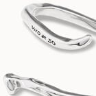 Bangle bracelet with a spiral-shaped nail