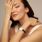 Sterling silver-plated watch with black leather strap and round white dial