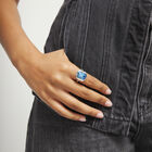 Rectangular ring with blue faceted crystal