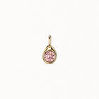 Charm with a pink crystal
