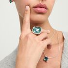 Drop-shaped ring with a green faceted crystal