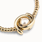 Pulsera el&aacute;stica de una vuelta ba&ntilde;ada en oro de 18k y abalorio doble luna y perla