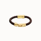 Brown braided leather bracelet with a metal detail