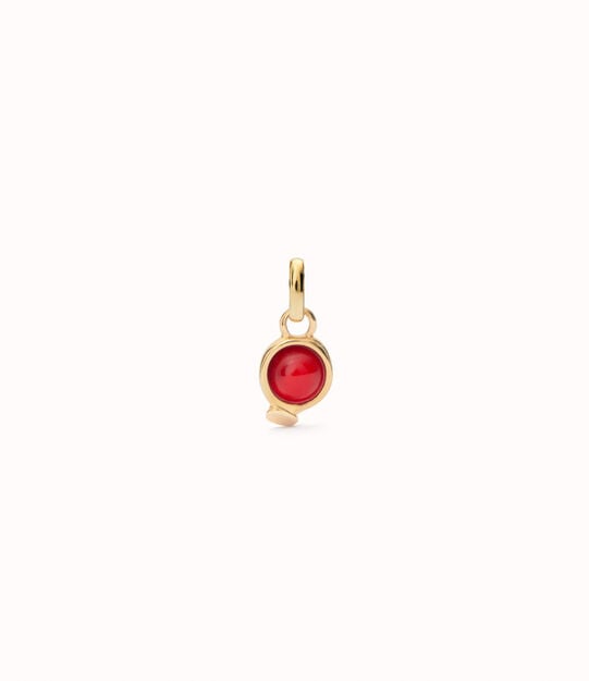 Charm with red stone