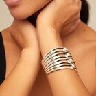 Bangle bracelet with multiple nail heads