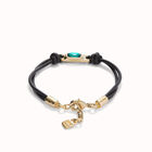 Leather bracelet with a green crystal