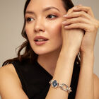 Link chain bracelet with a blue crystal