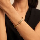 Brazalete con forma de clavo ba&ntilde;ado en oro de 18k
