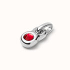 Charm with oval red crystal