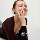 Ring with blue oval faceted crystal
