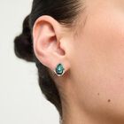 Earrings with a green drop-shaped faceted crystal