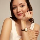 18K gold-plated watch with black leather strap and round white dial