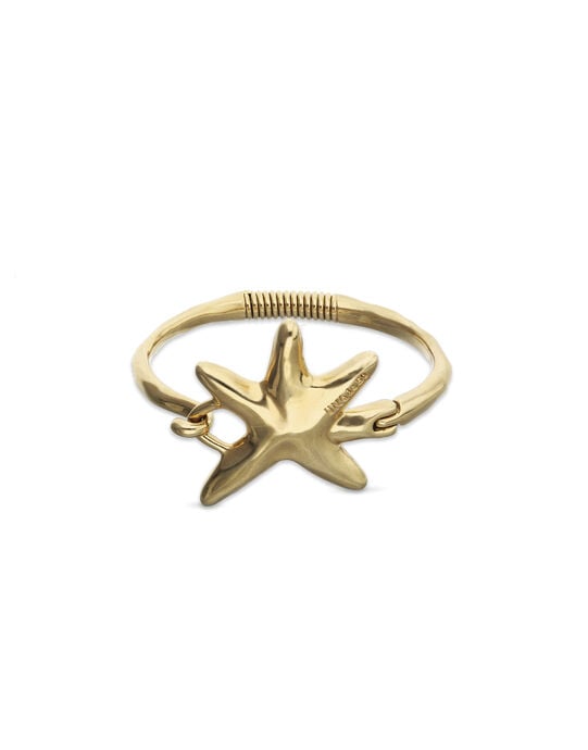 Pulsera r&iacute;gida ba&ntilde;ada en oro con estrella de mar