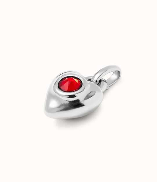Sterling silver-plated charm with red crystal.