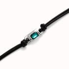 Leather bracelet with a green crystal