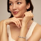 Beaded bracelet with blue crystals and a central butterfly