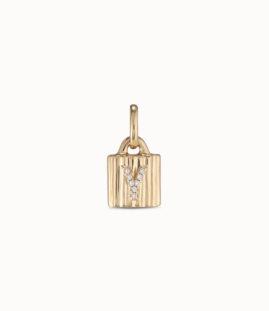Charm candado bañado en oro de 18K ley con letra de topacios Y