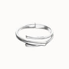 Bangle bracelet with three intertwined organic shapes
