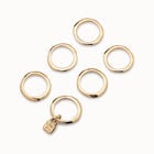 Multi row ring with a charm