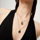 Multi strand necklace with two black oval faceted crystals
