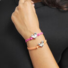 Pulsera de hilo el&aacute;stico naranja con coraz&oacute;n ba&ntilde;ado en plata de ley