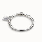 Beaded stretch bracelet with tubular piece and charms