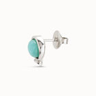 Piercing ba&ntilde;ado en plata de ley y un cristal azul