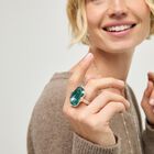 Rectangular ring with a green faceted crystal