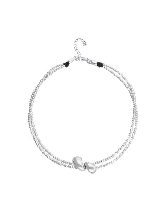 Multi-strand necklace with two intertwined drops