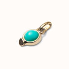 Charm with red stone