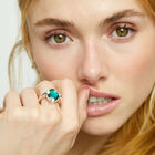 Ring with green oval faceted crystal