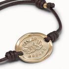 Pulsera Solidaria con placa ba&ntilde;ada en oro de 18K