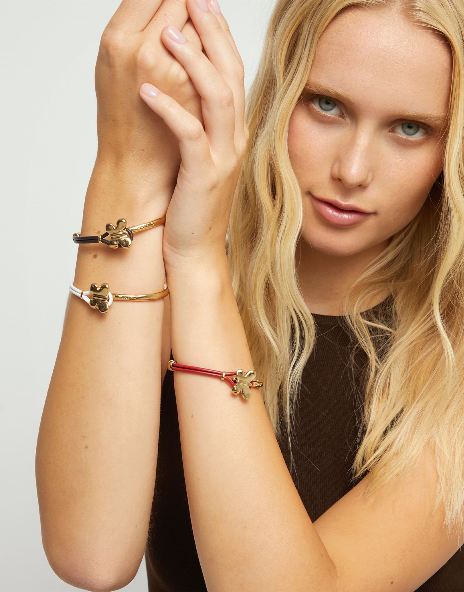 Red leather bracelet with butterfly ornament
