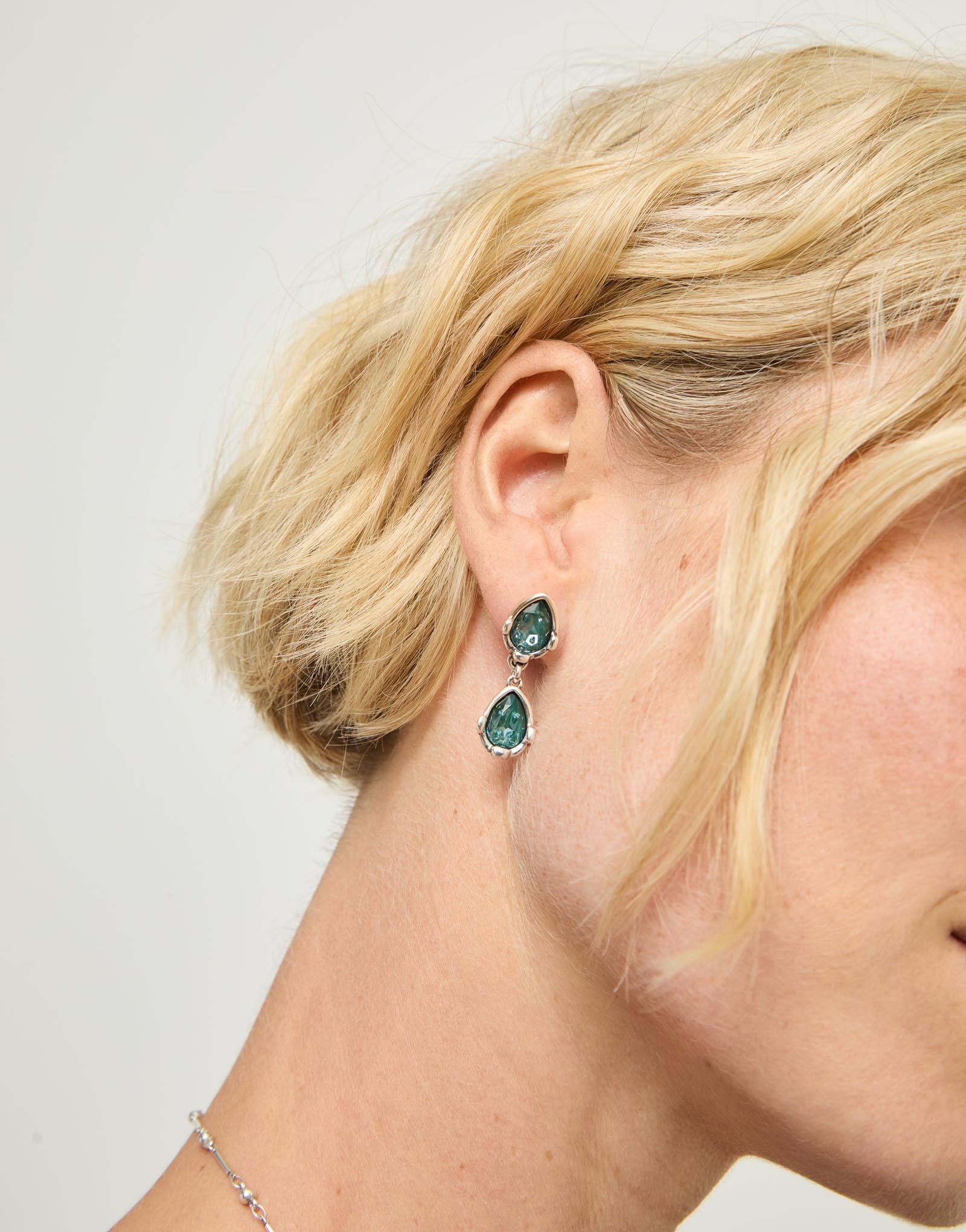 Long  earrings with two green drop-shaped faceted crystals