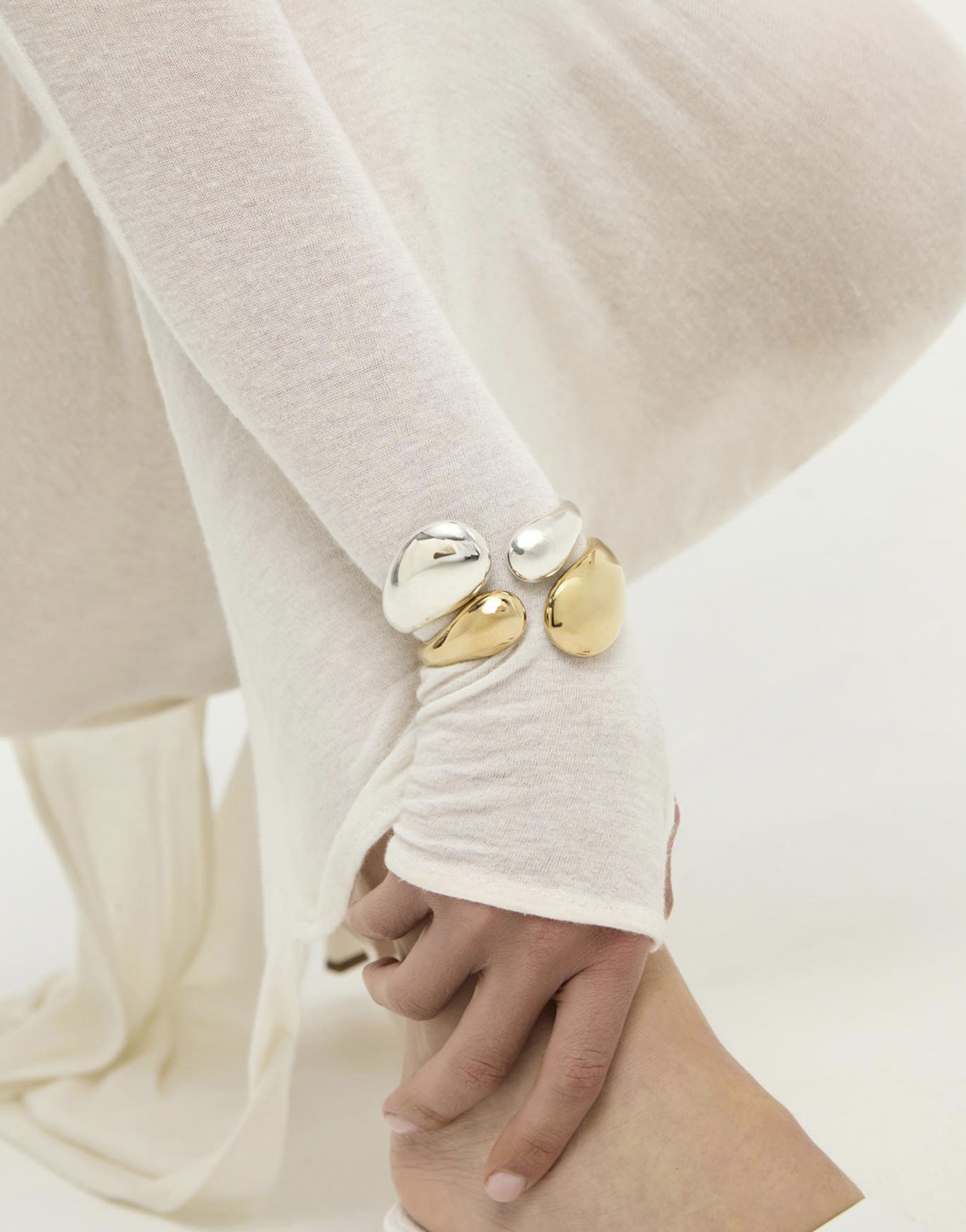 Bangle bracelet with two irregular drops