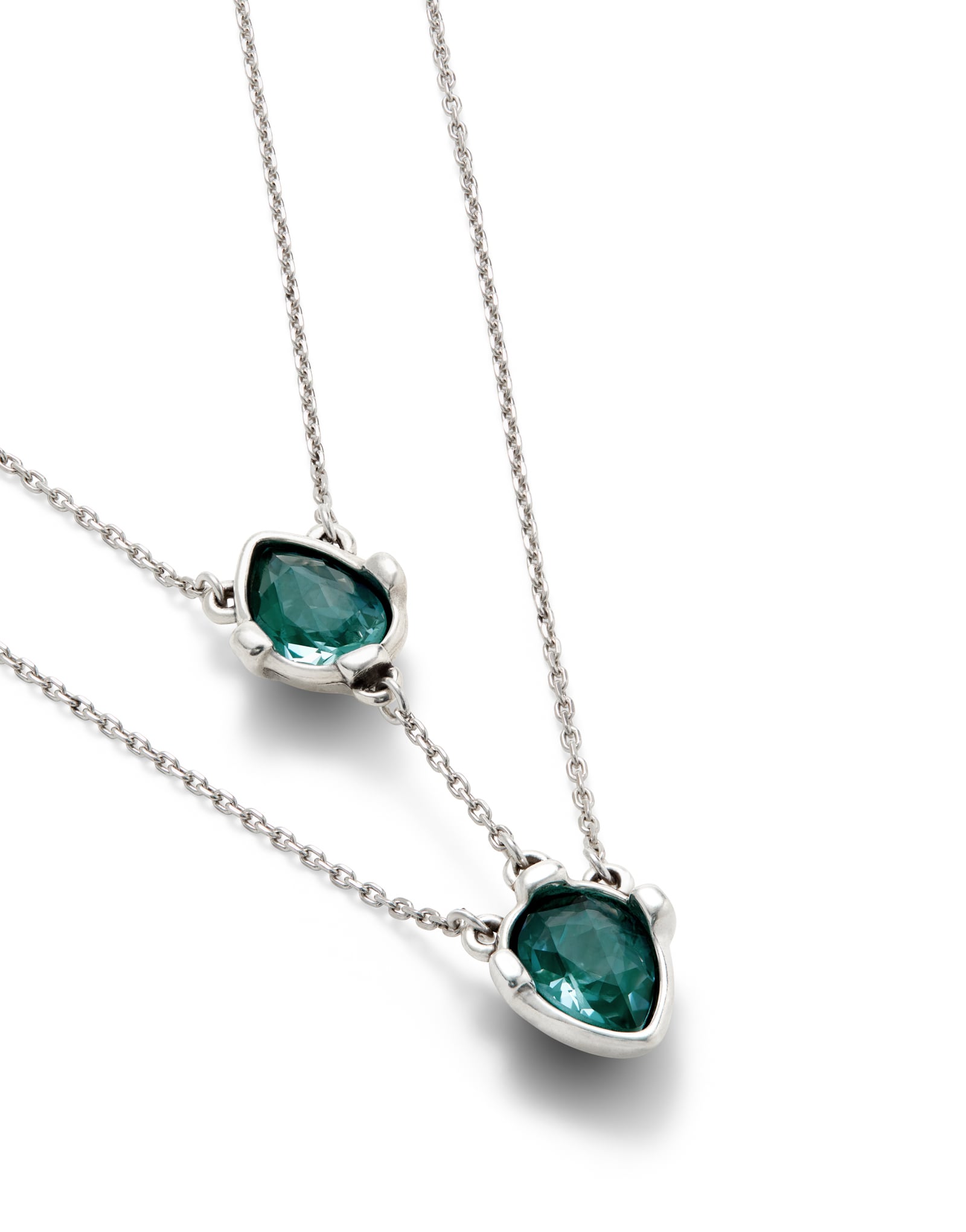 Double necklace with two drop-shaped pendants featuring blue faceted crystals