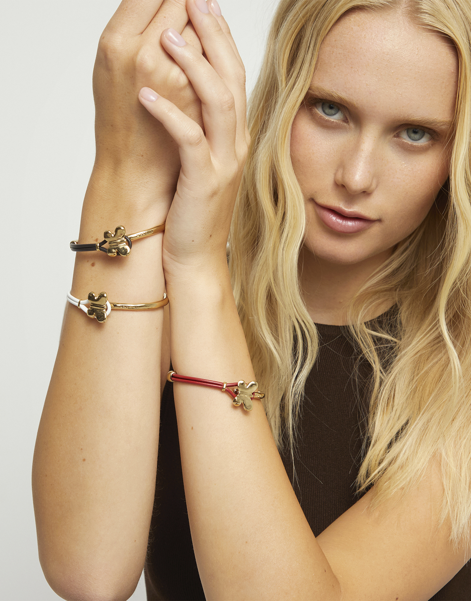 Brown leather bracelet with butterfly ornament