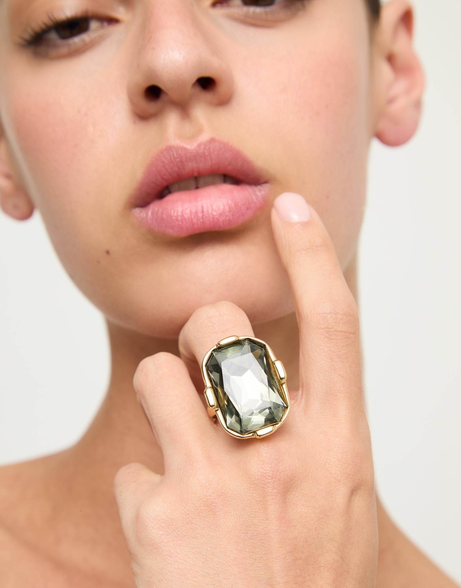 Rectangular ring with a grey faceted crystal