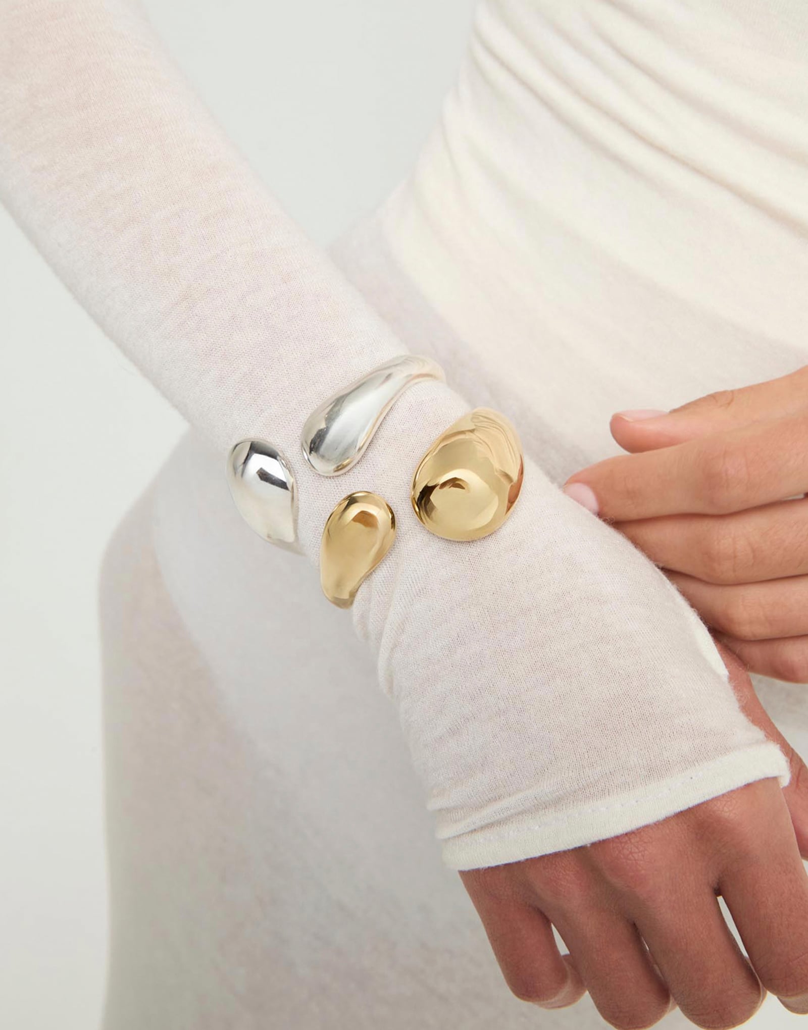 Bangle bracelet with two irregular drops